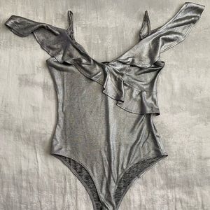 Silver ruffle off shoulder body suit stretchy.